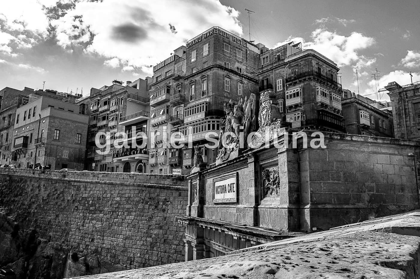 A black-and-white photograph of Victoria Gate, one of Valletta's historic entrances.
