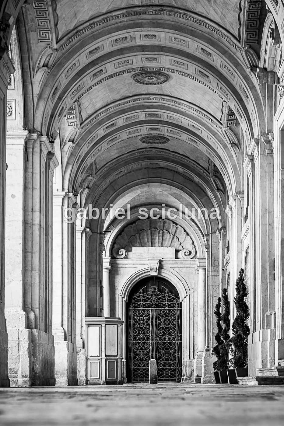 A black-and-white study of Valletta's historic architecture and limestone details.