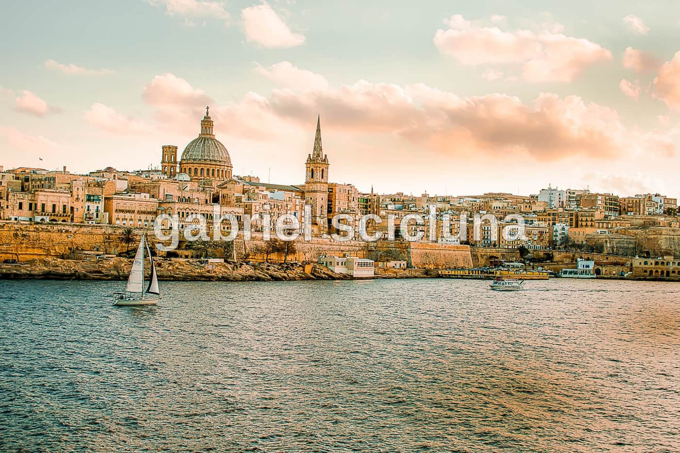 An architectural view of Valletta's harbour and historic fortifications.