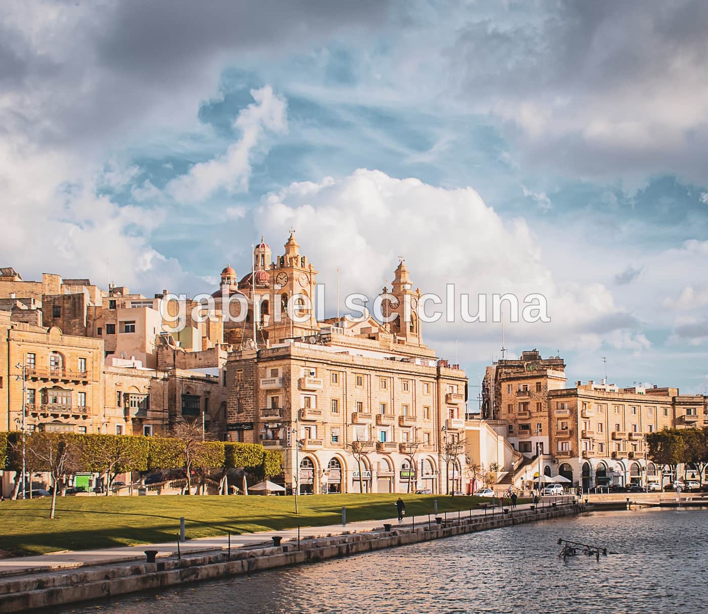 A waterfront view of Bormla (Cospicua), capturing limestone architecture in Malta's Three Cities.