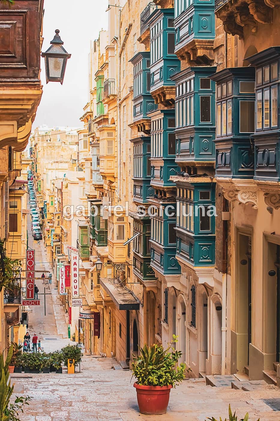 A photograph of Valletta's traditional limestone buildings and distinctive Maltese balconies.